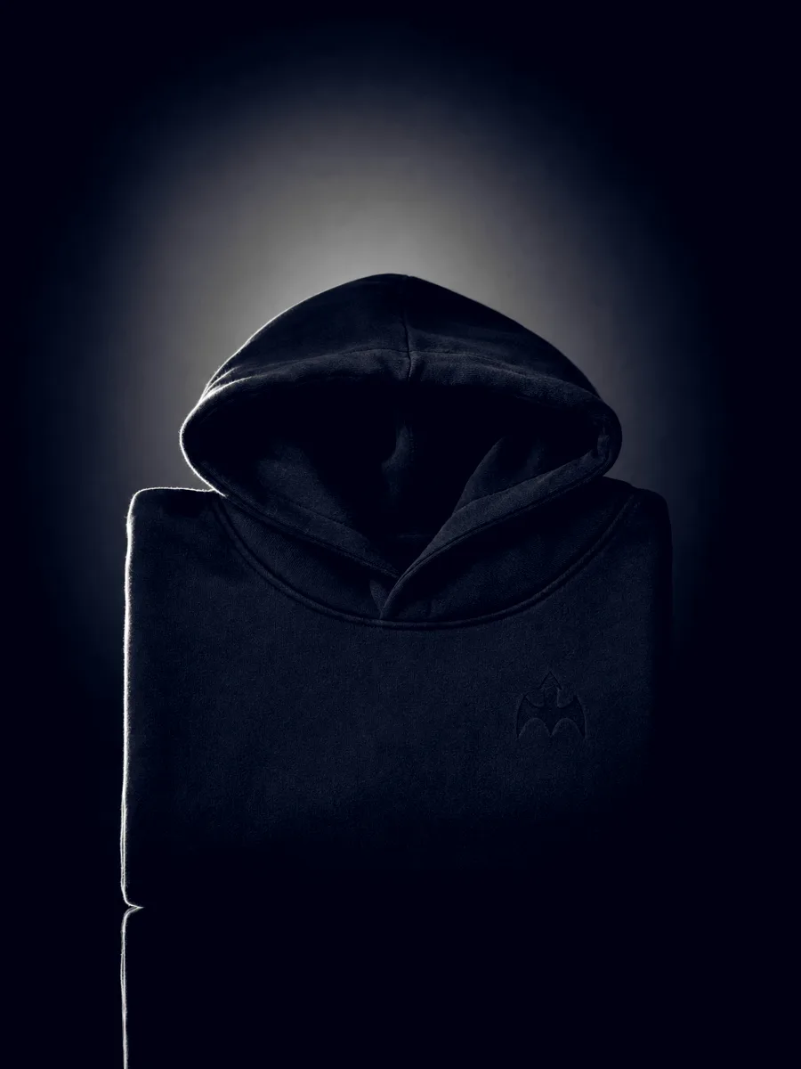 Black BirdHaus hoodie with a tonal chest mark, shot on black